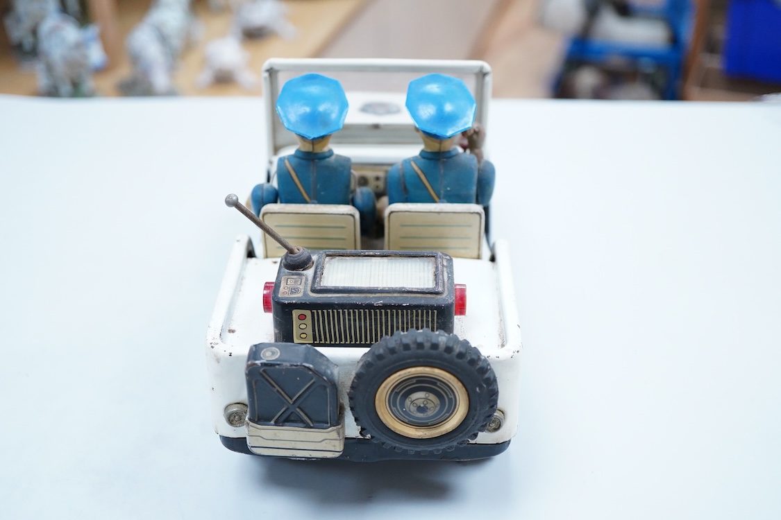 A 1960s Japanese T.N. Nomura battery powered tinplate and plastic Police Department Jeep, impressed manufacturer’s logo and ‘Made in Japan’ to the base